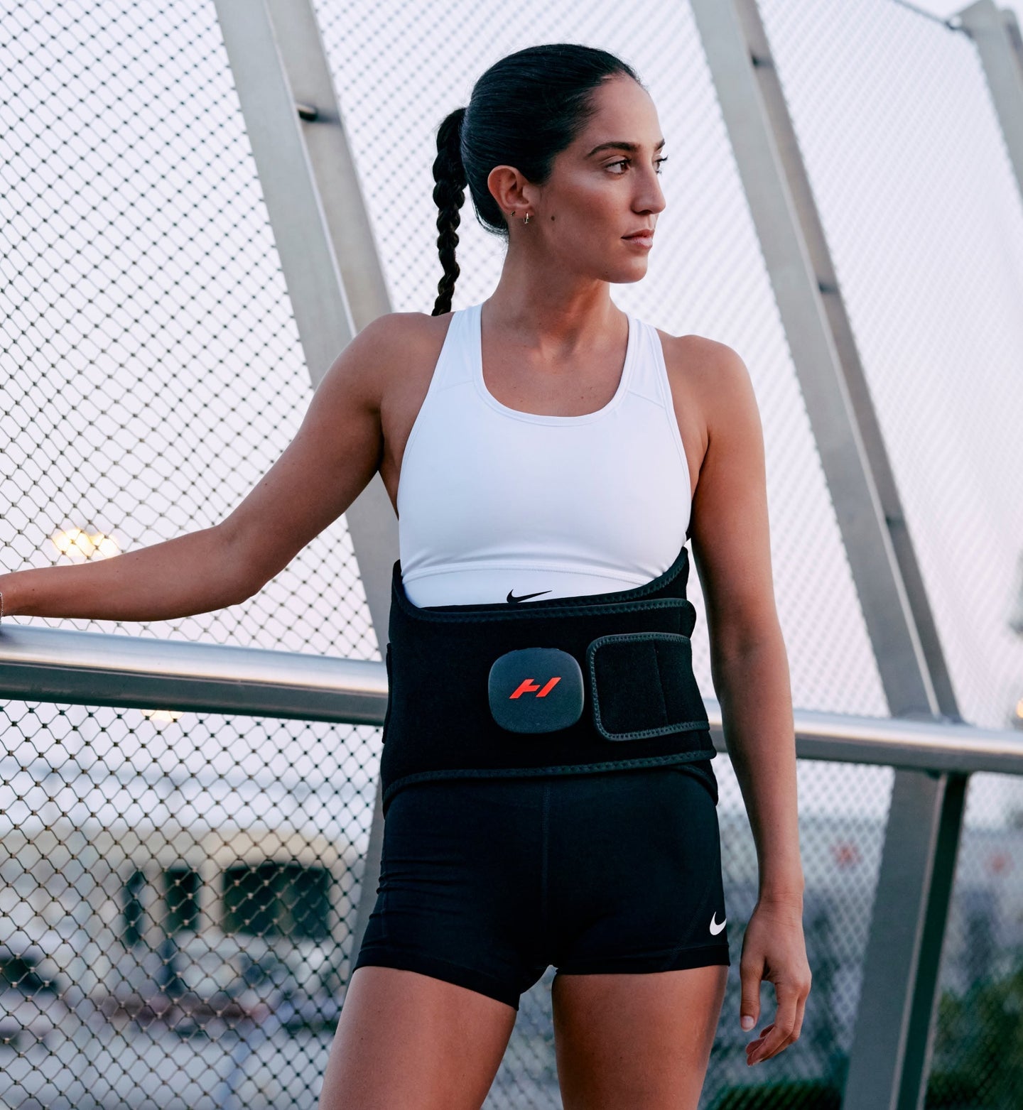 Woman wearing a venom 2 back against a blurred outdoor background